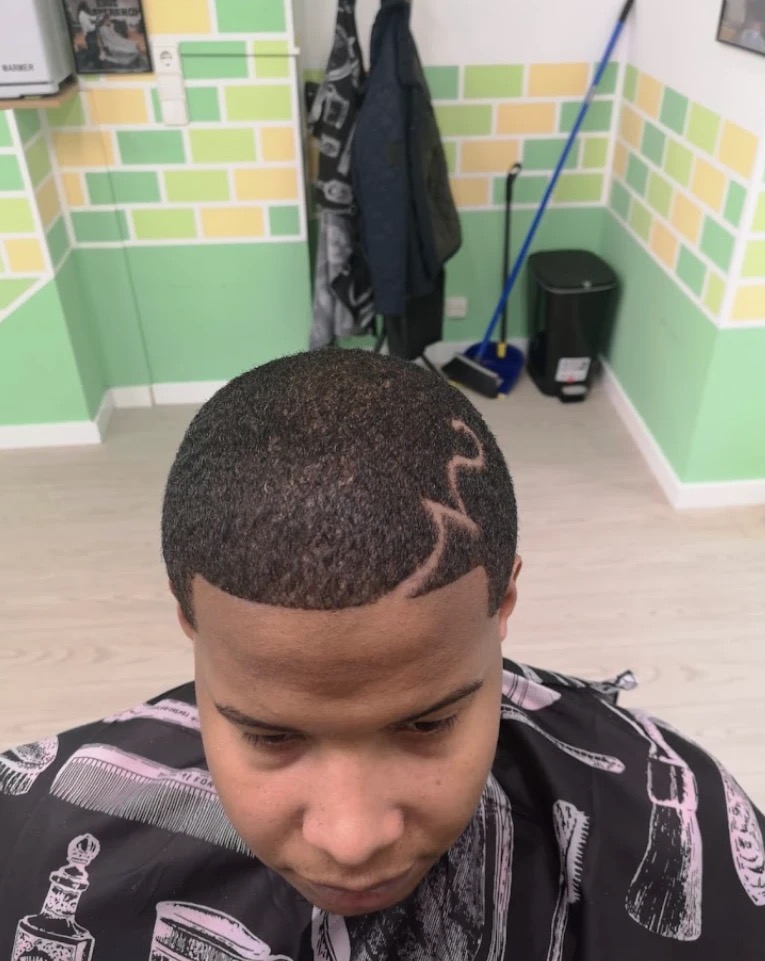 A close-up of a precision hair design cut by One Love Barbershop